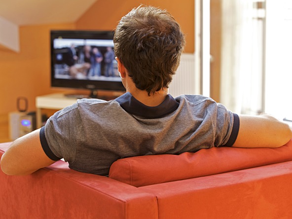 Man watching TV_crop